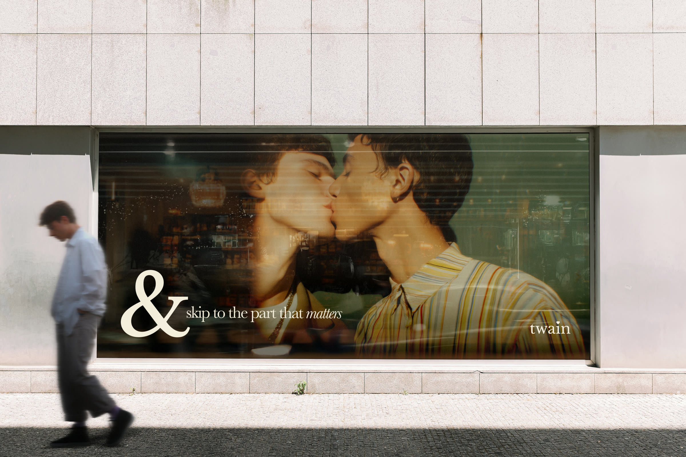 twain billboard on a city storefront — 'skip to the part that matters'